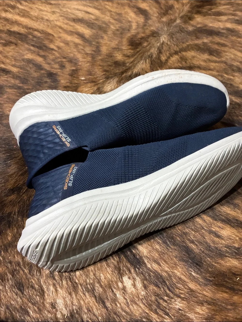 Sketchers men’s blue slip in shoes in size 12.